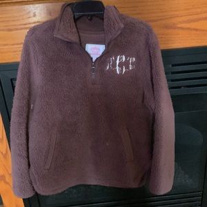 Fuzzy fleece pull over jacket with ACC embroidered on chest. Had pockets. Size m